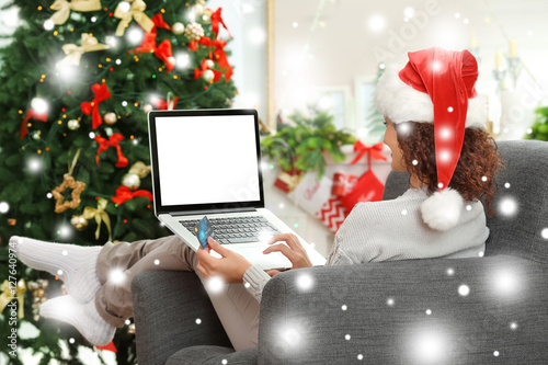 Woman shopping online with ...