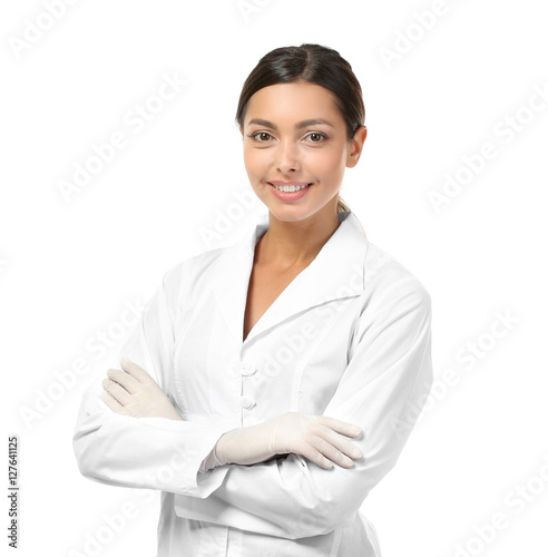 Young female dentist wearing in uniform isolated on white
