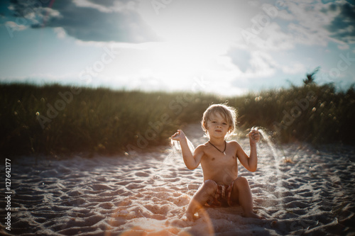 boy playing in sand