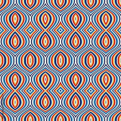 Bright ethnic abstract background. Seamless pattern with symmetric geometric ornament.