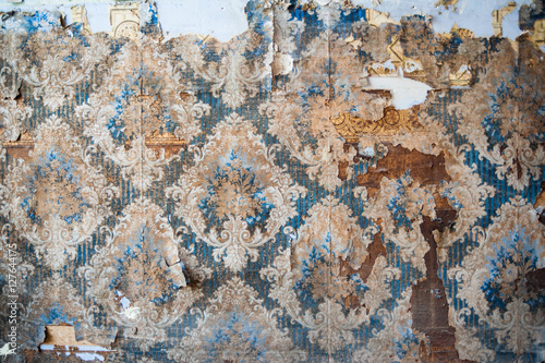 Vintage textures: old wallpaper, peeling paint, brick wall and layers of different colorful backgrounds.