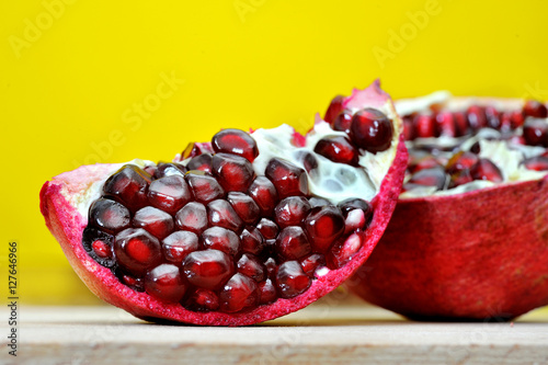 fresh pomegranate on a yellow background