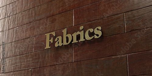 Fabrics - Bronze plaque mounted on maple wood wall - 3D rendered royalty free stock picture. This image can be used for an online website banner ad or a print postcard.