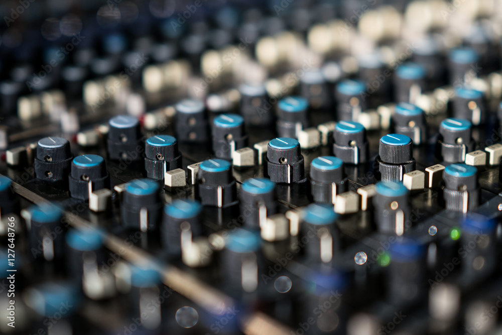 Vintage sound or audio mixer in a recording studio. Knobs, dials and  sliders on a soundboard. Stock-Foto | Adobe Stock