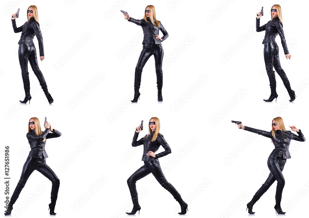Woman in leather costume with gun isolated on white Woman in leather costume with gun isolated on white