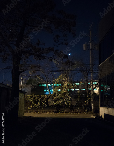 Train with Moon in Dark City Alley at Night © Bruno Passigatti