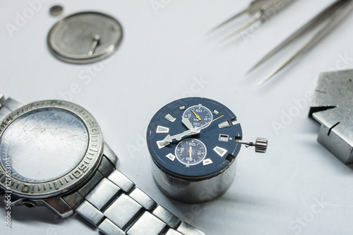 Watch repair on the table.