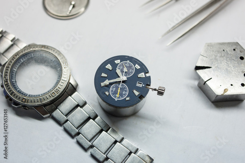 Watch repair on the table.