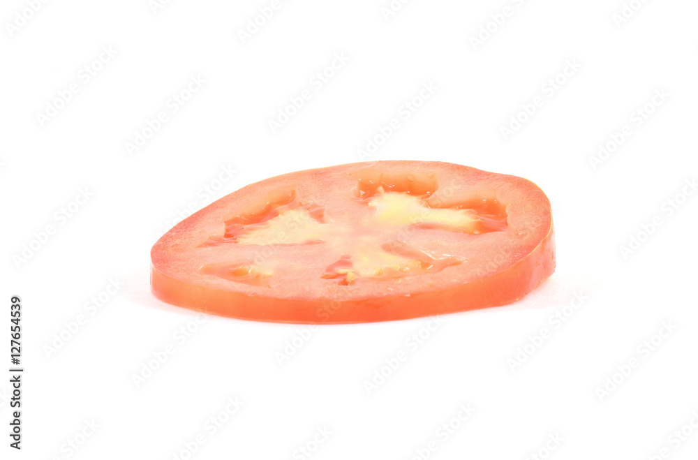 Fresh slice of organic heirloom tomato Fresh slice of organic heirloom tomato