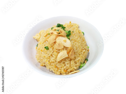Thai garlic fried rice with vegetable on top in white bowl isolated on white background, Clipping path included