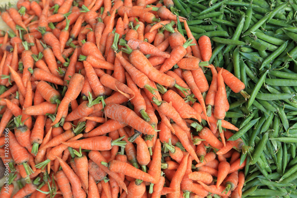 fresh carrots and green peas selling at the street shop fresh carrots and green peas selling at the street shop