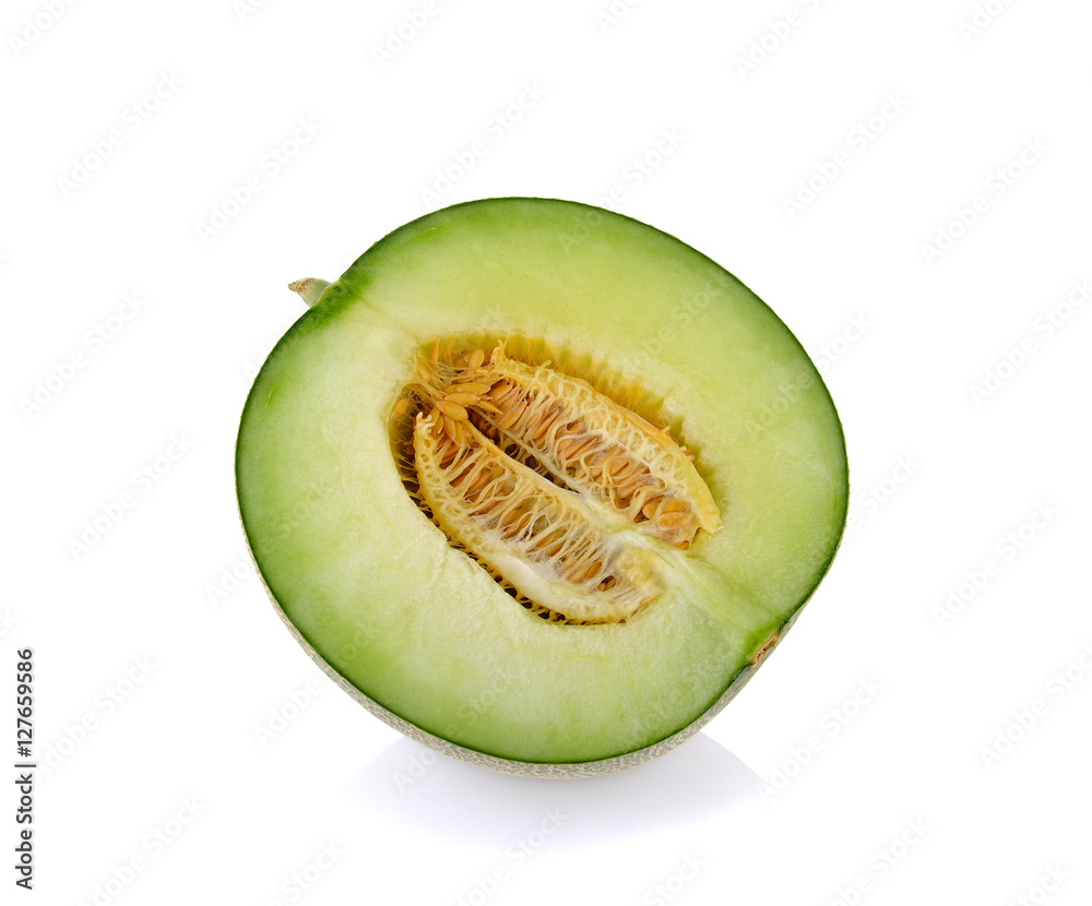 Green cantaloupe melon slices on white Green cantaloupe melon slices on white
