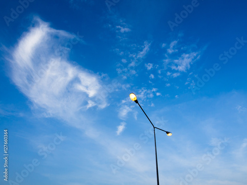 Light tower under blue sky in early evening