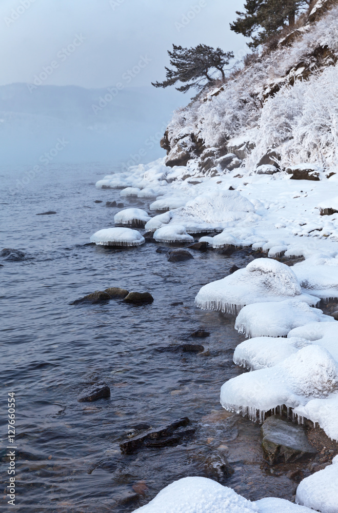 Lake Baikal. November. Shore near the source of the Angara River Lake Baikal. November. Shore near the source of the Angara River