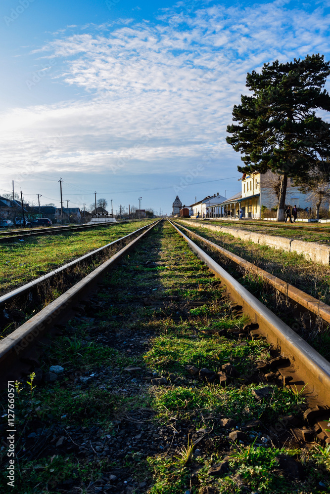 Fototapeta premium old iron rails with green grass