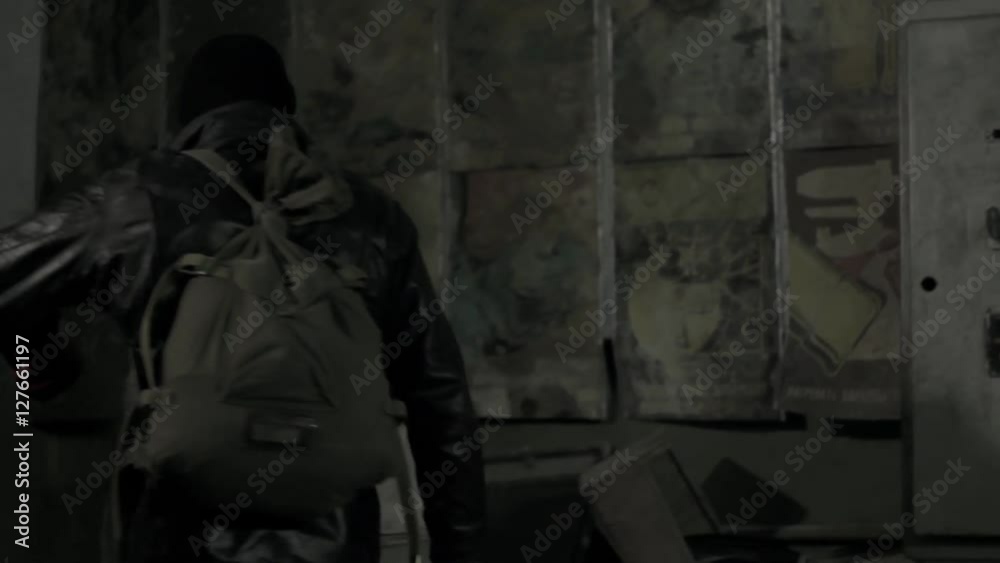 Stalker explores underground abandoned vault for weapon in post-apocalyptic world