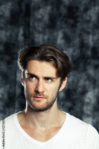 Portrait of handsome young thoughtful man