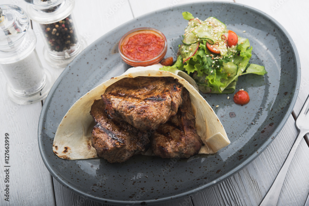 pieces of steak in pita bread pieces of steak in pita bread