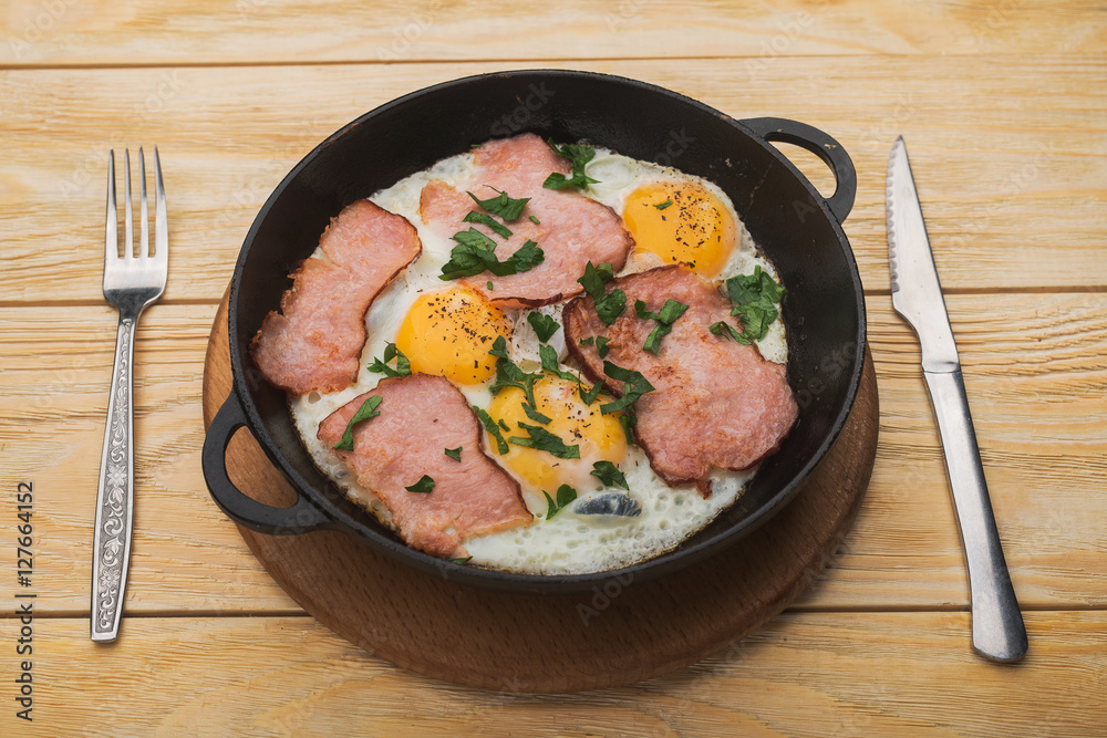 bacon and eggs in a pan bacon and eggs in a pan