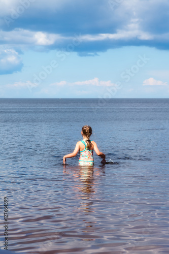 Girl swimming in the lake