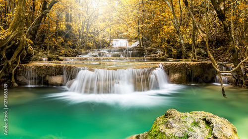 Huay Man Khamin Waterfall in autumn forest in the national park of Thailand photo