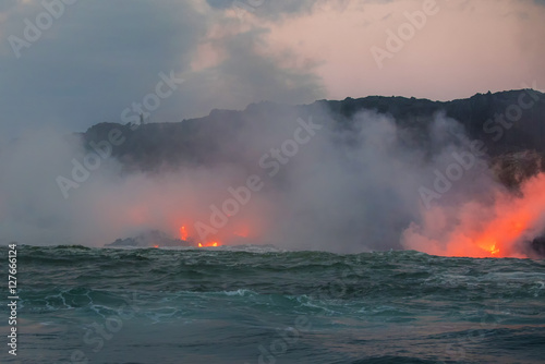Molten lava flowing into the Pacific Ocean on Big Island of Hawa