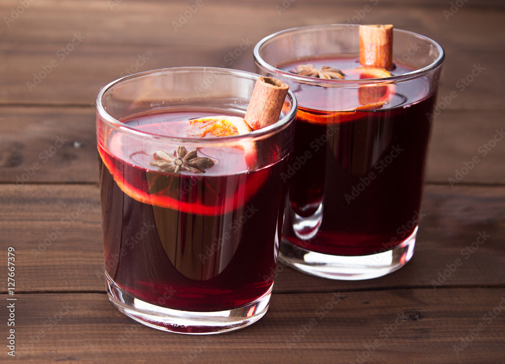 Mulled wine and spices on wooden background Mulled wine and spices on wooden background