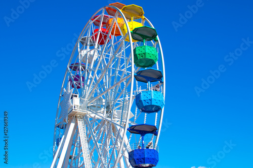 Barcelona, Spain. November 23, 2016: a colorful ferris wheel at Mount Tibidabo against the bright blue sky on 23 November 2016 photo