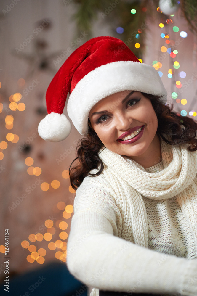 Beautiful mature woman wearing Christmas hat Beautiful mature woman wearing Christmas hat