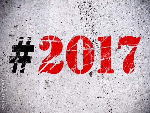 New Year 2017 hashtag rubber stamp on grunge concrete wall illustration