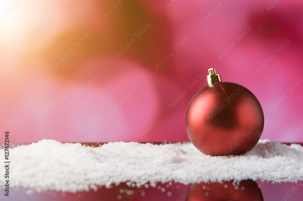 christmas balls in snow,ligths bokeh background christmas balls in snow,ligths bokeh background