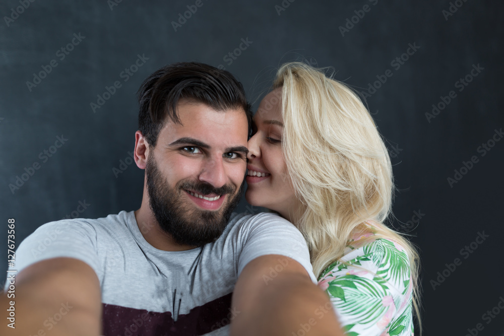 Youth and technology. Young attractive students couple taking se Youth and technology. Young attractive students couple taking se