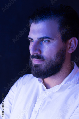 Portrait of a bearded man light by fluorescent light. Bearded m