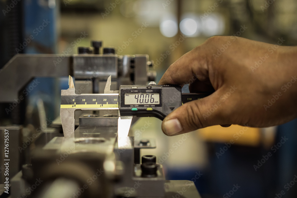 Fototapeta premium Vernier caliper measure part of jig fixture in factory