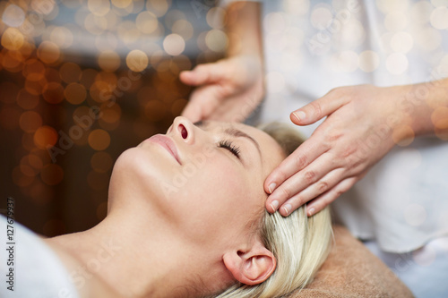 close up of woman having face massage in spa