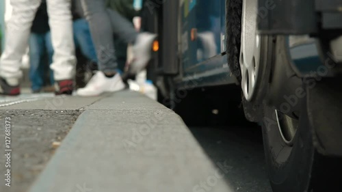 Wallpaper Mural Tramway and bus station focused on pedestrians feet. Find similar clips in our portfolio. Torontodigital.ca