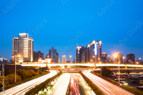 busy traffic on road in chongqing new city at night