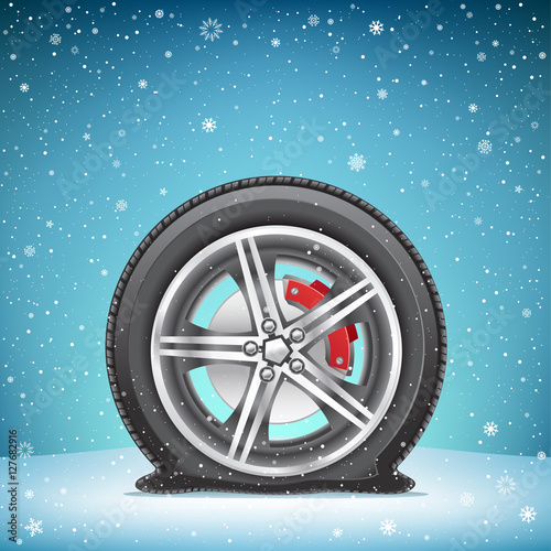 winter flat tire on snow background