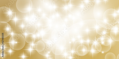 Abstract bokeh with gold background. Festive defocused lights