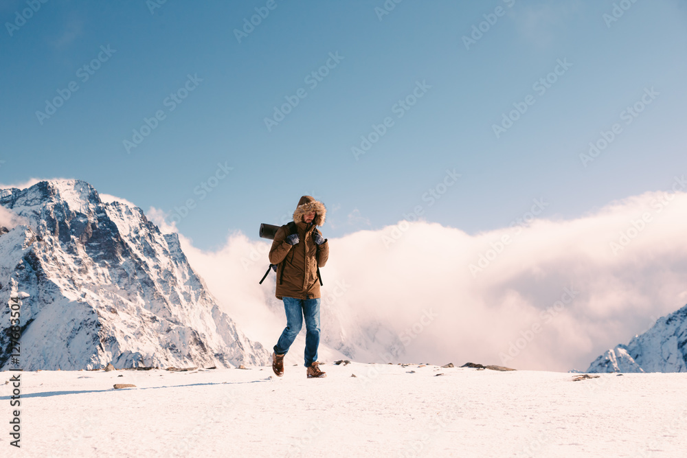 Hiker in mountains in winter