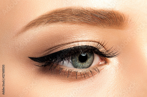Close up view of gray woman eye with beautiful makeup