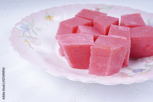 Colorful of Coconut Jelly or Layer Sweet Cake (Thai name is Kanom Chan) on white dish. Thailand ancient dessert