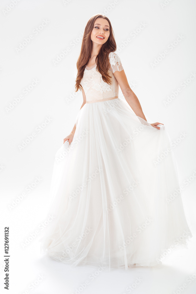 Full-length portrait of pretty bride