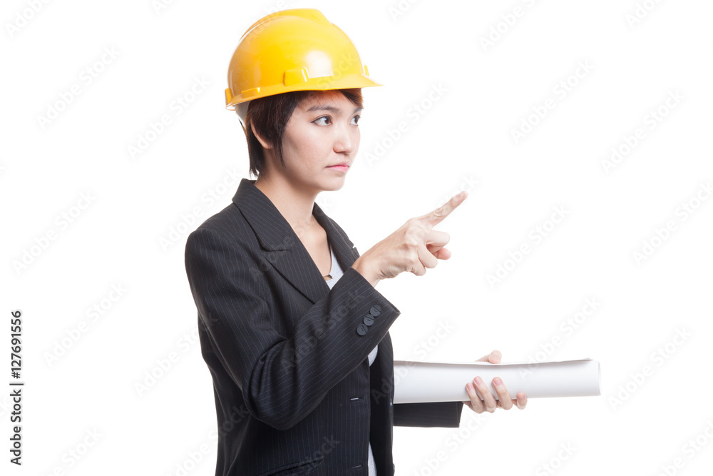 Asian engineer woman pointing with blueprints. Asian engineer woman pointing with blueprints.