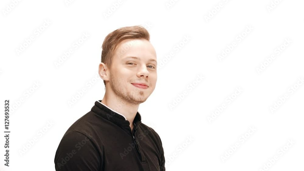 Young handsome man smiling, winking, pointing finger at camera over white background. Young handsome man smiling, winking, pointing finger at camera over white background.