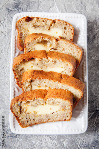 Sliced banana bread with cream cheese
