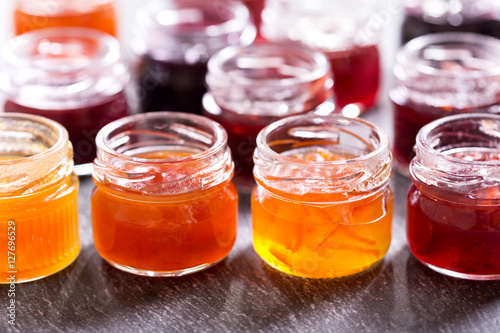 various jars of fruit jam photo