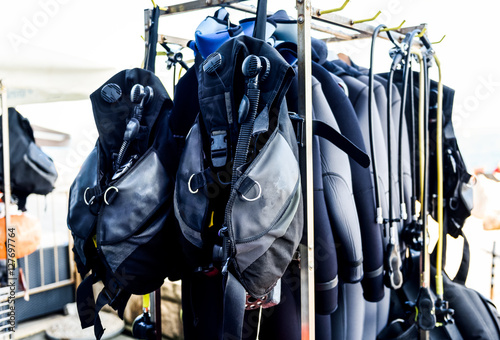 Scuba diving gear ona a stand in diving center. photo