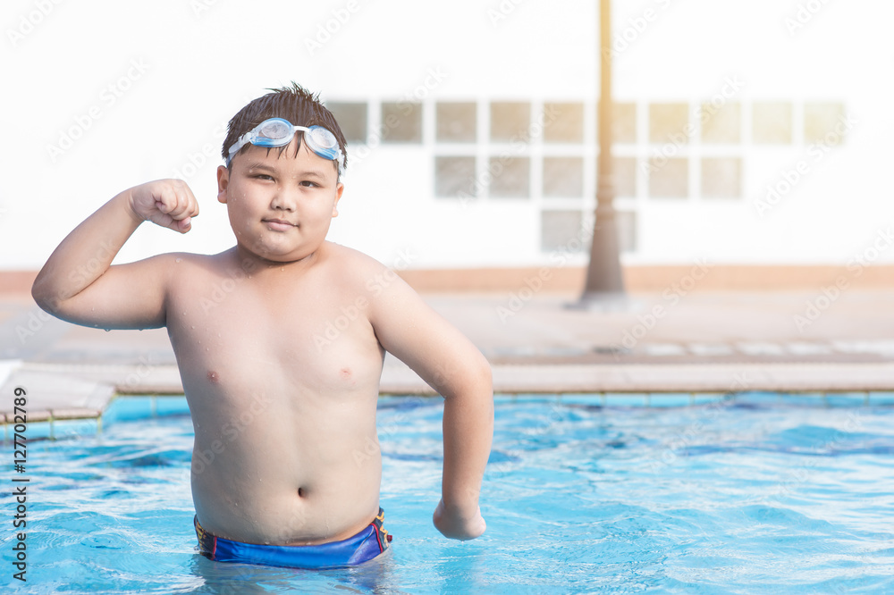 obese fat boy swimming pool.