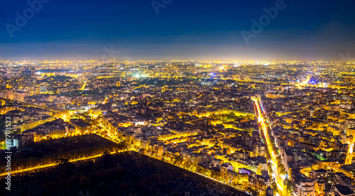 Aerial view of Paris, France at night. © Augustin Lazaroiu